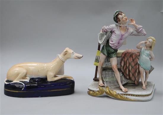 A Capo di Monte figural group and a Staffordshire dog